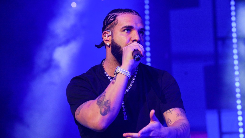 How can Drake release an album while suing his record label?